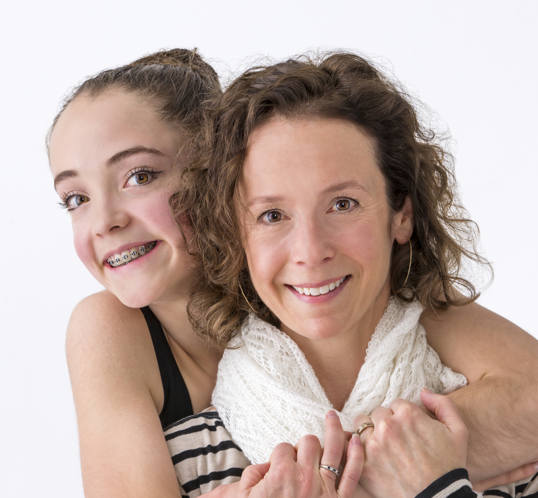 Studio portrait of of female teenage ballerina dancer with her mother