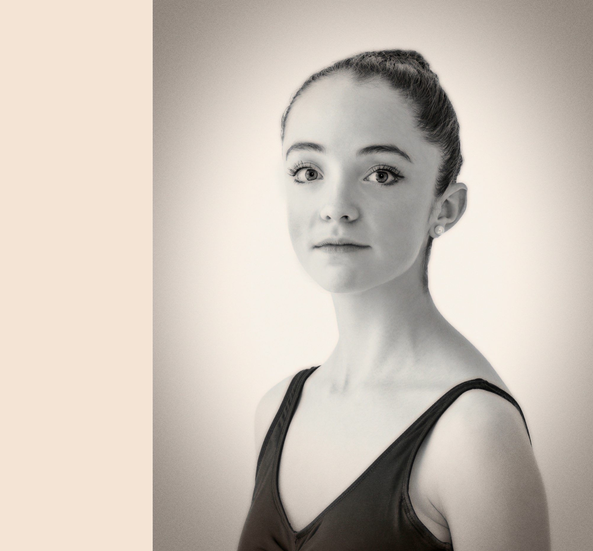 Black & white studio portrait of of female teenage ballerina dancer