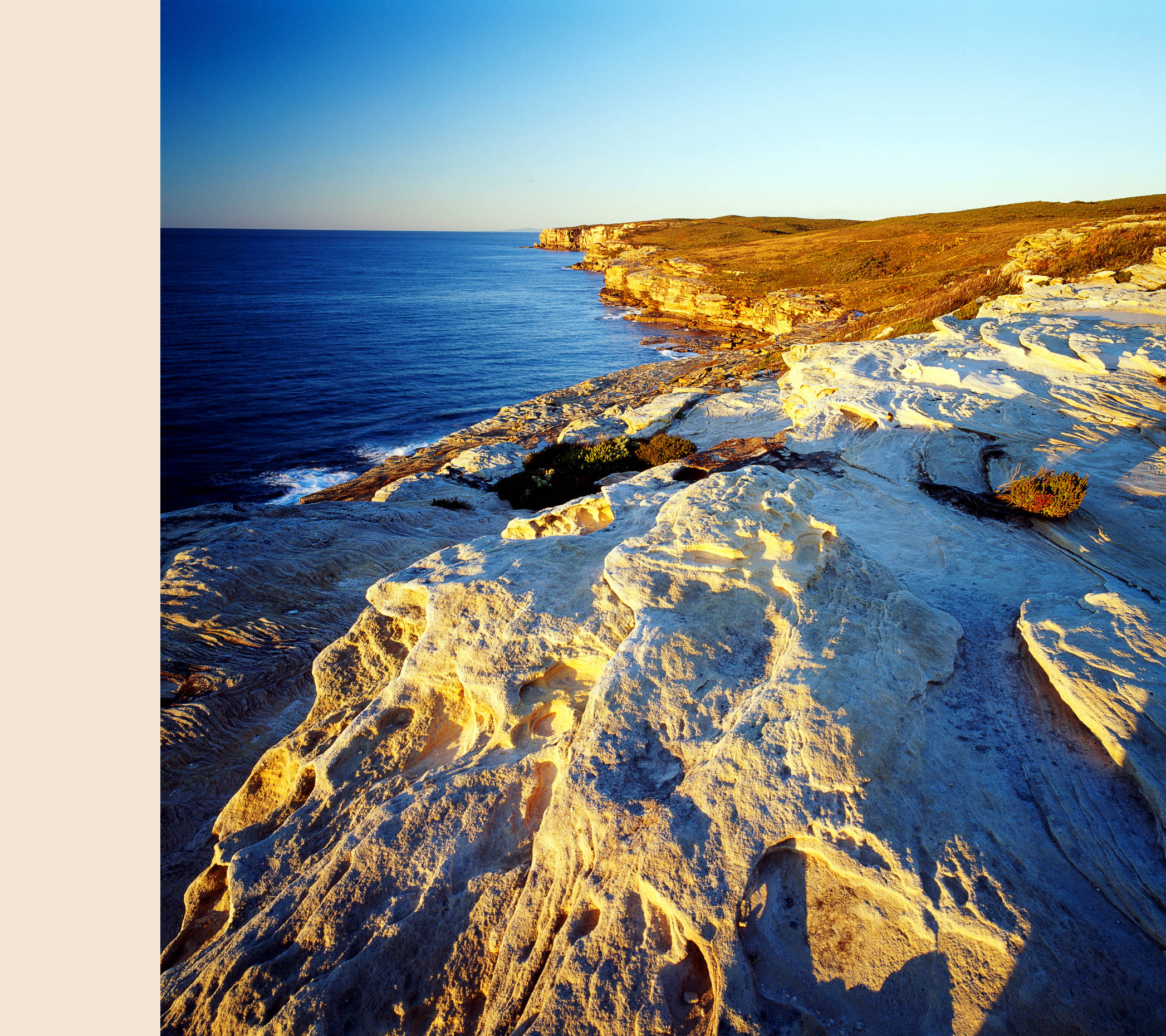 Sunrise view of sandstone cliffs along Pacific Ocean at Royal Na
