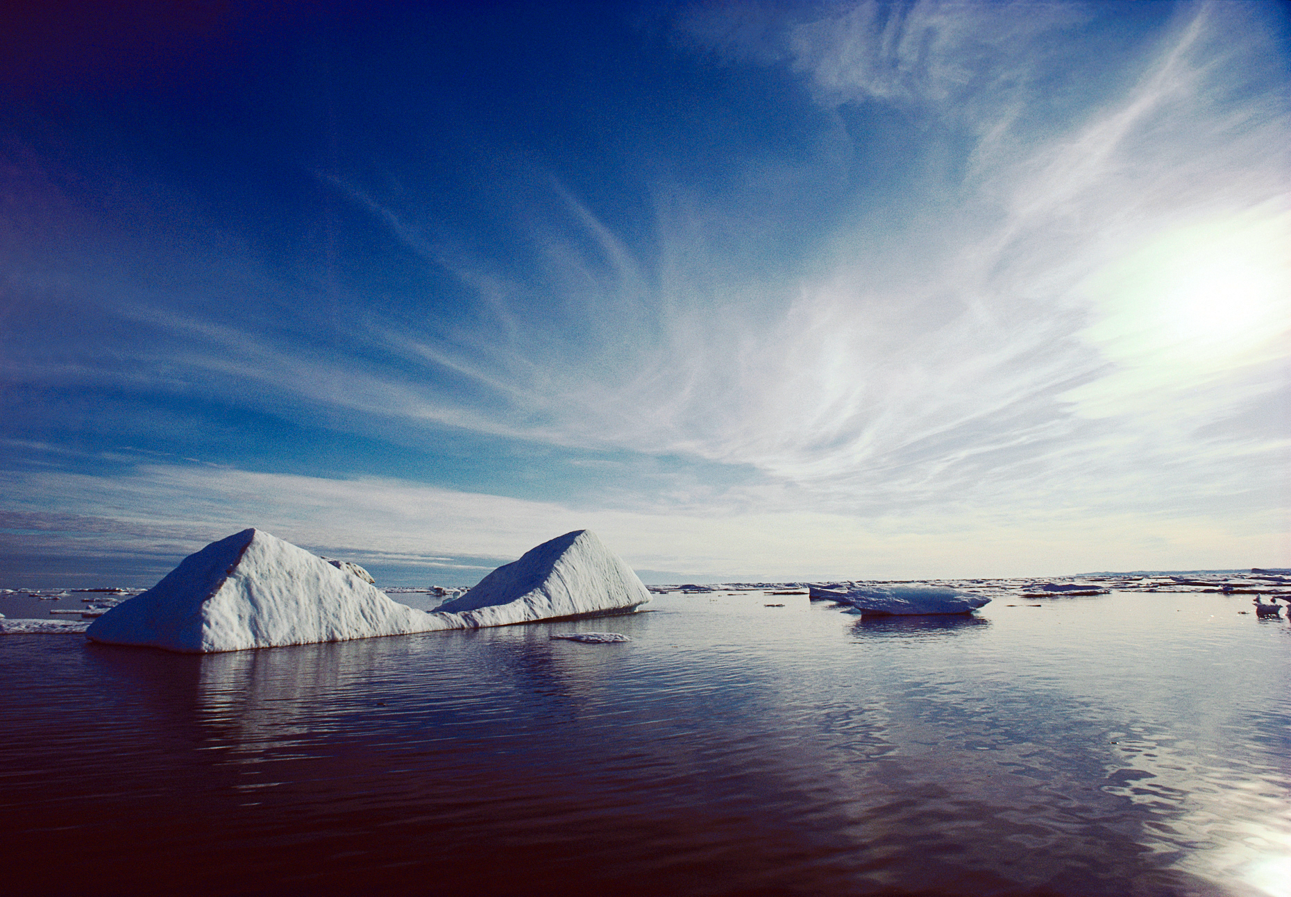 Double triangular shaped iceberg floating in Frobisher Bay, Cumberland Sound near Baffin Island, Nunavut, Canada