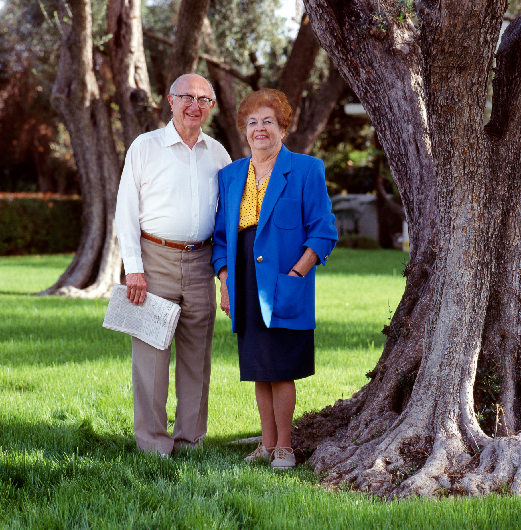 Portrait of retired couple outside their southern California hom