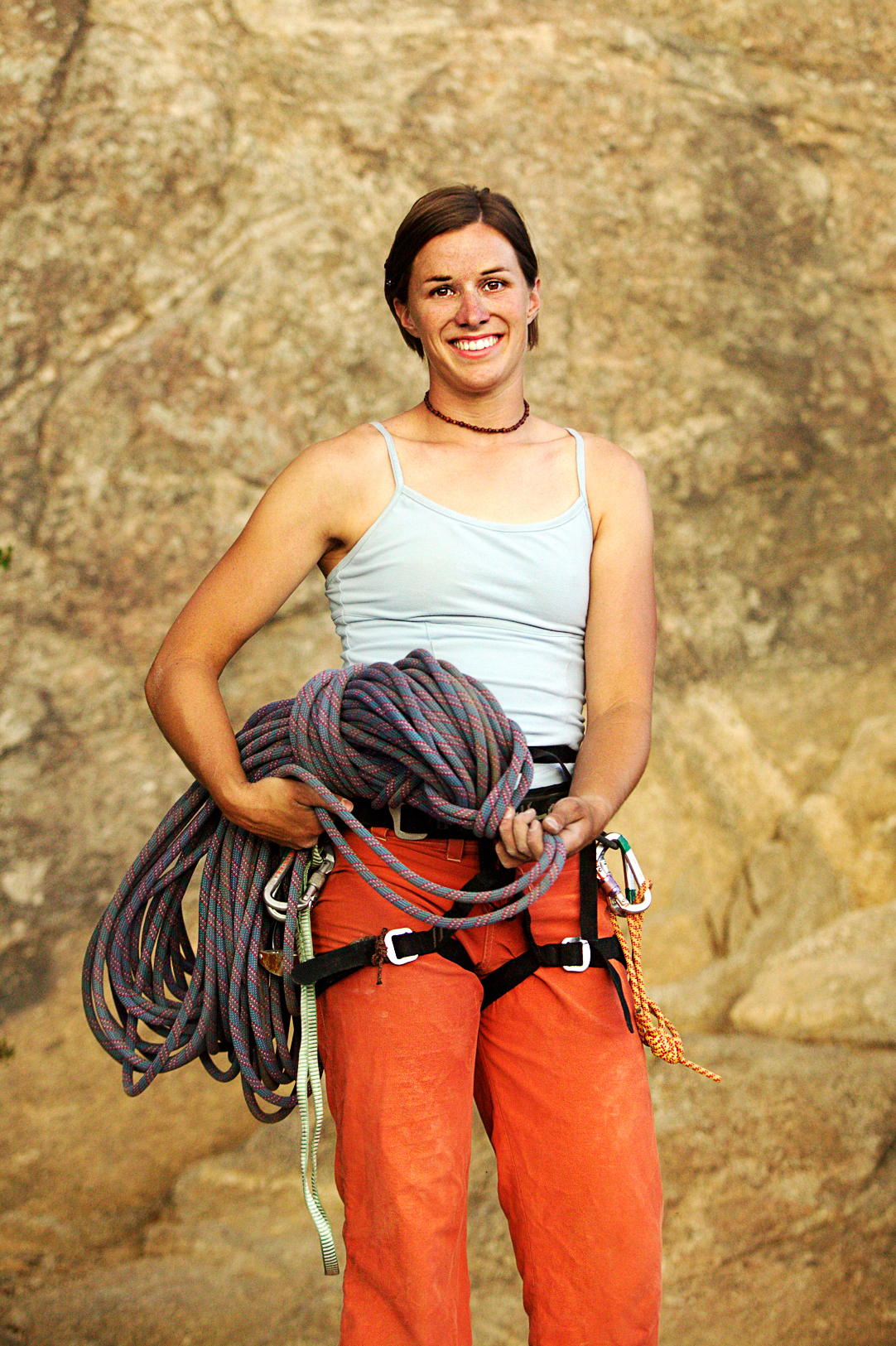 Young woman rock climbing at Elephant Rock, near Buena Vista, Colorado, USA