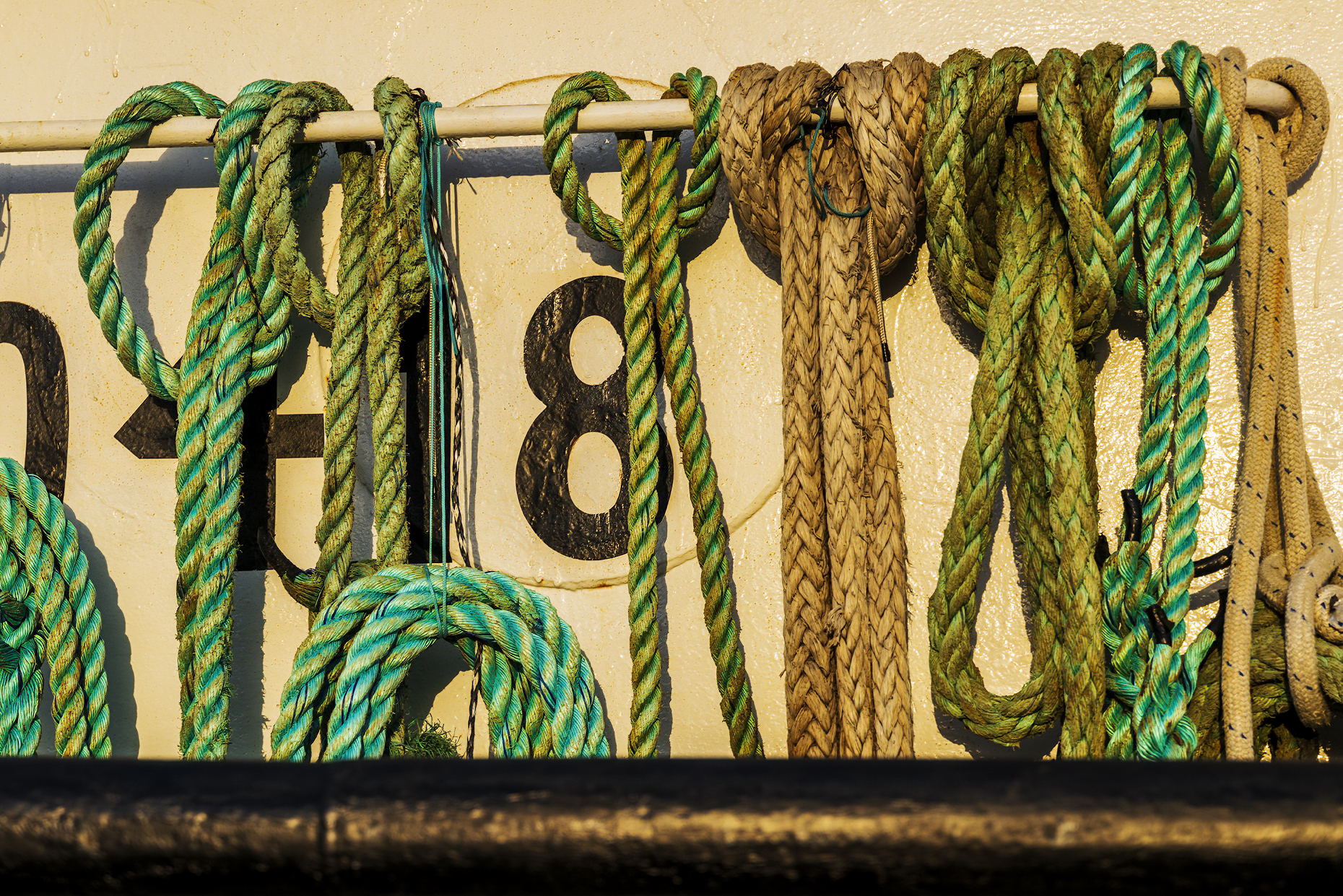 Detail of ropes & fishing gear; boats at dock; harbor; Newport; Oregon; USA
