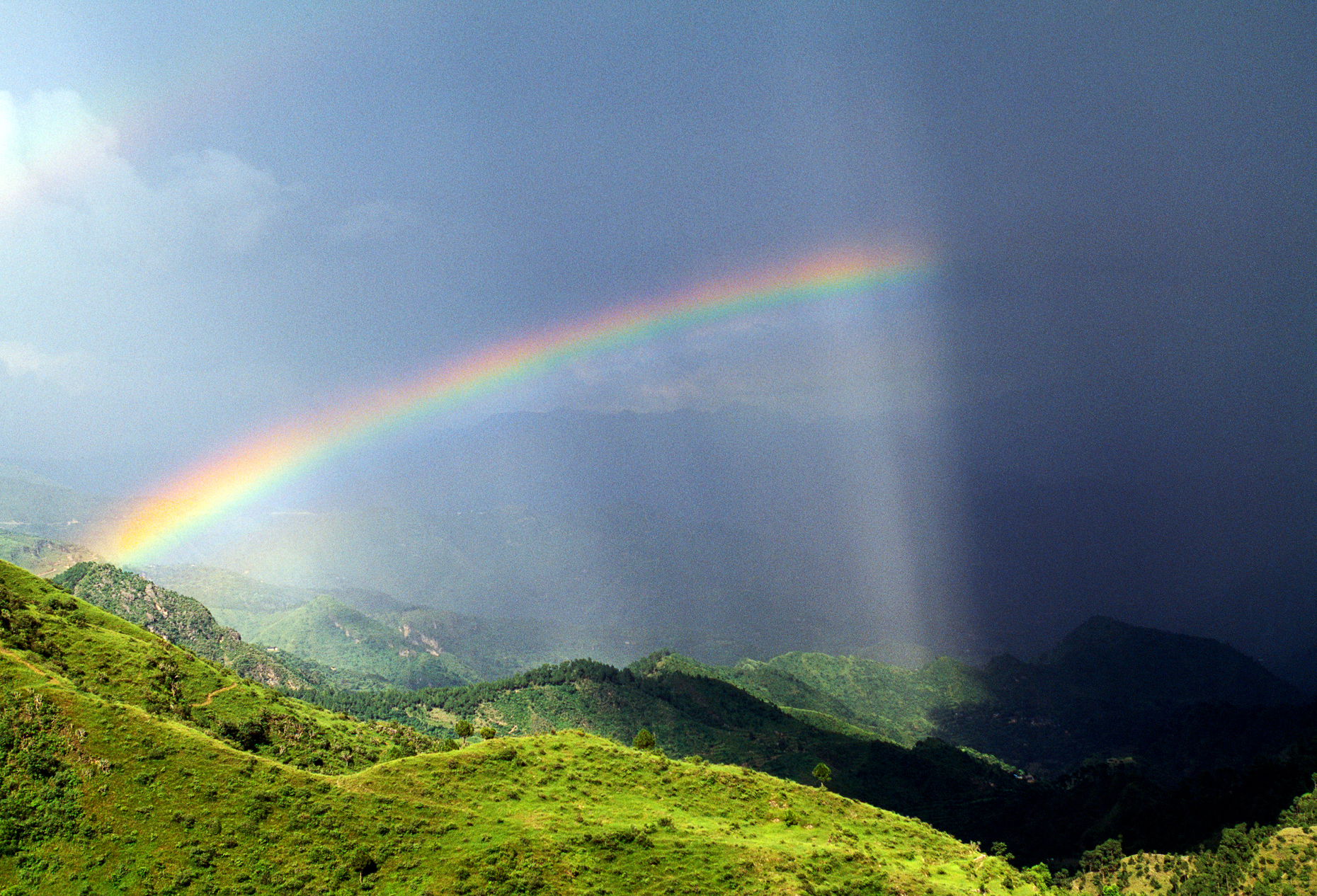 Rainbow over lush green hills in the "Lessor Himalayas", Darlagh