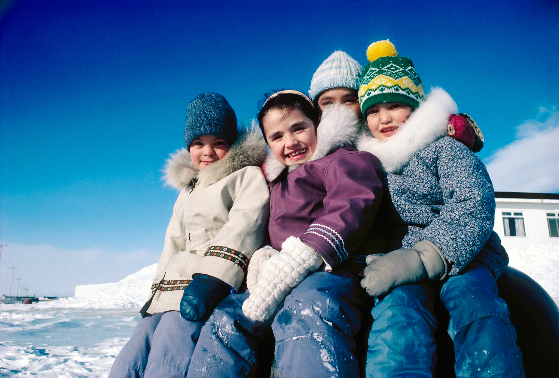 Inuit children pose for a photograph during school recess, Iqalu