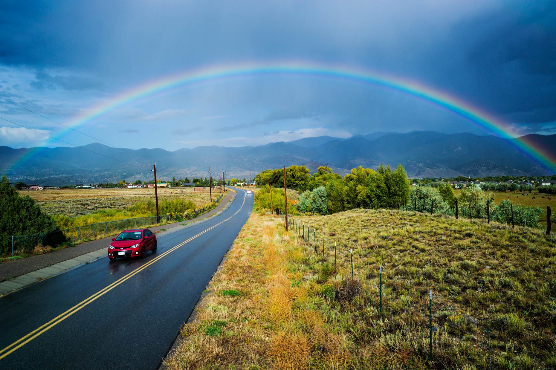 Rainbow over CR 120 & the small mountain town of Salida, Colorado, USA