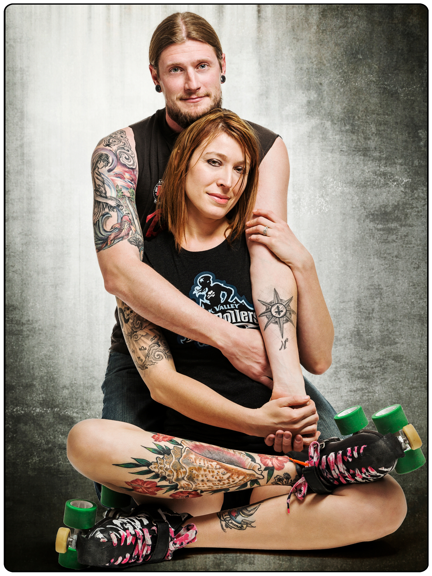 Studio portrait of man and woman with tattoos