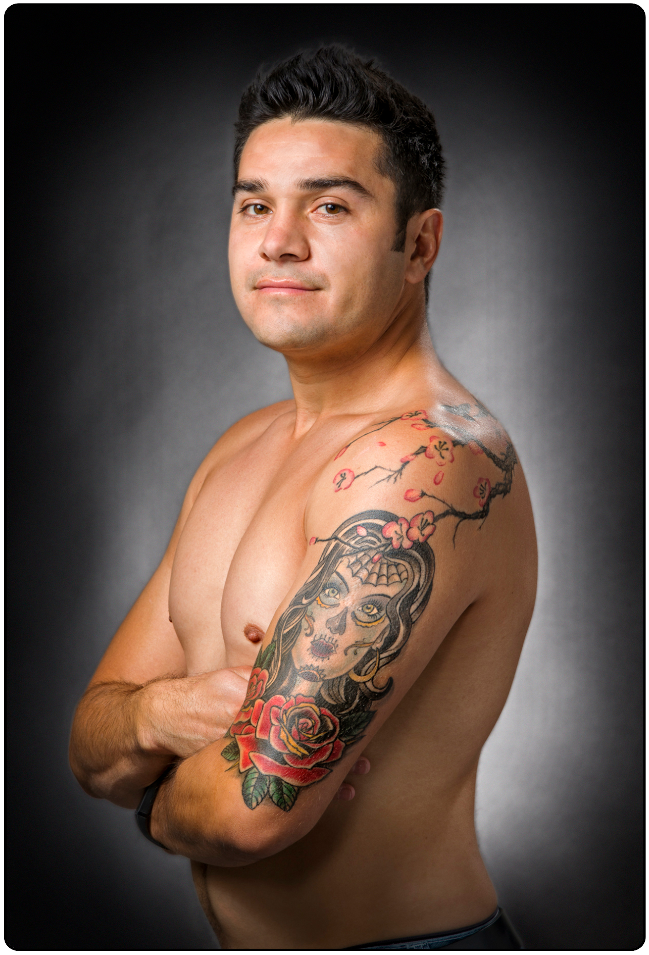 Studio portrait of tattoos on a Hispanic man
