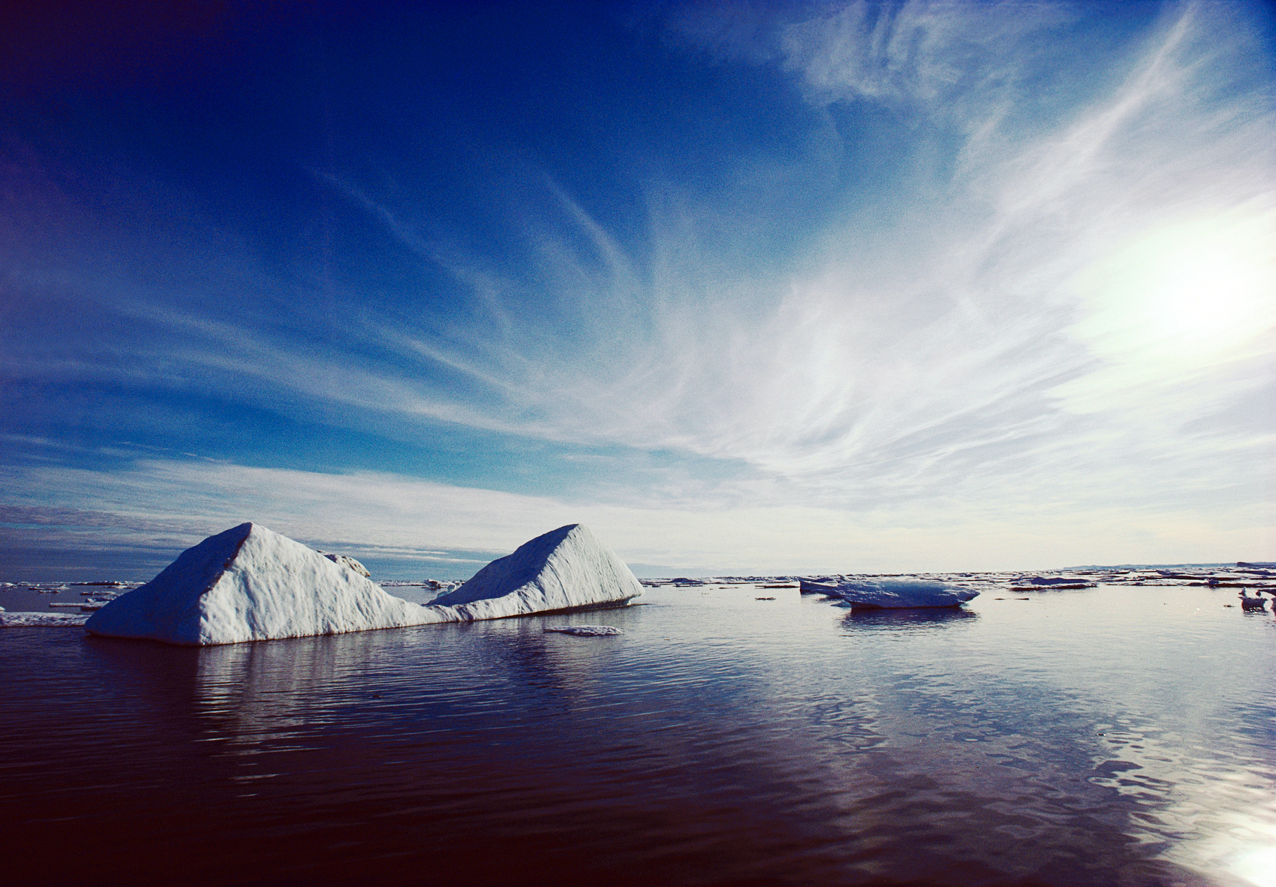 Double triangular shaped iceberg floating in Frobisher Bay, Cumberland Sound near Baffin Island, Nunavut, Canada
