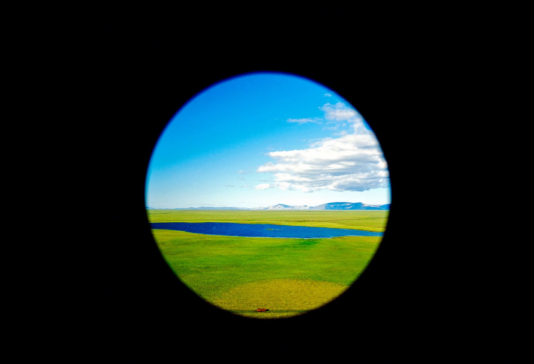Aerial view through Aeroflot helicopter window of the arctic tun