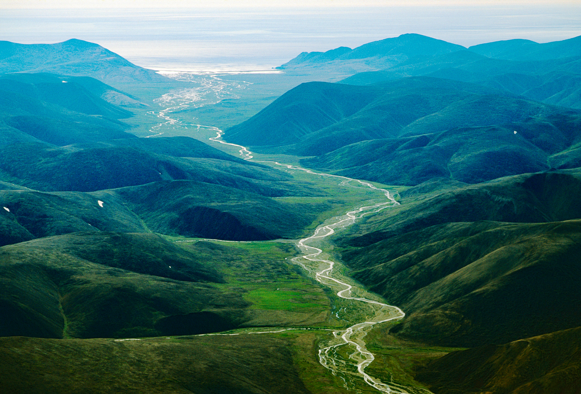 Aerial view of remote river draining into Bering Sea; between Provideniya & Egvekinot; Siberia; Chuchki Peninsula; Magadan Region; Russian Federation (former Soviet Union - USSR)