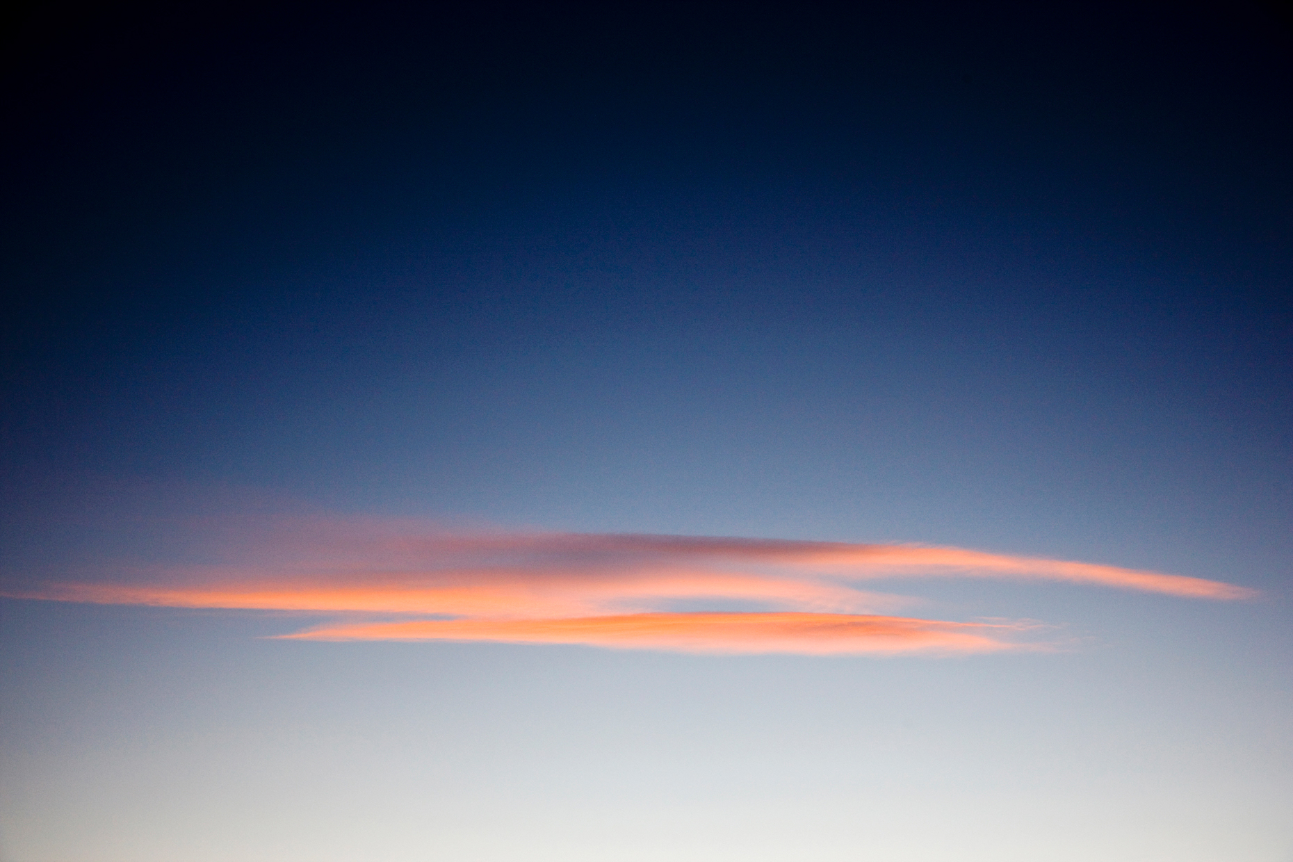 Pink clouds against a blue sky at sunset, Chaffee County, Colorado, USA