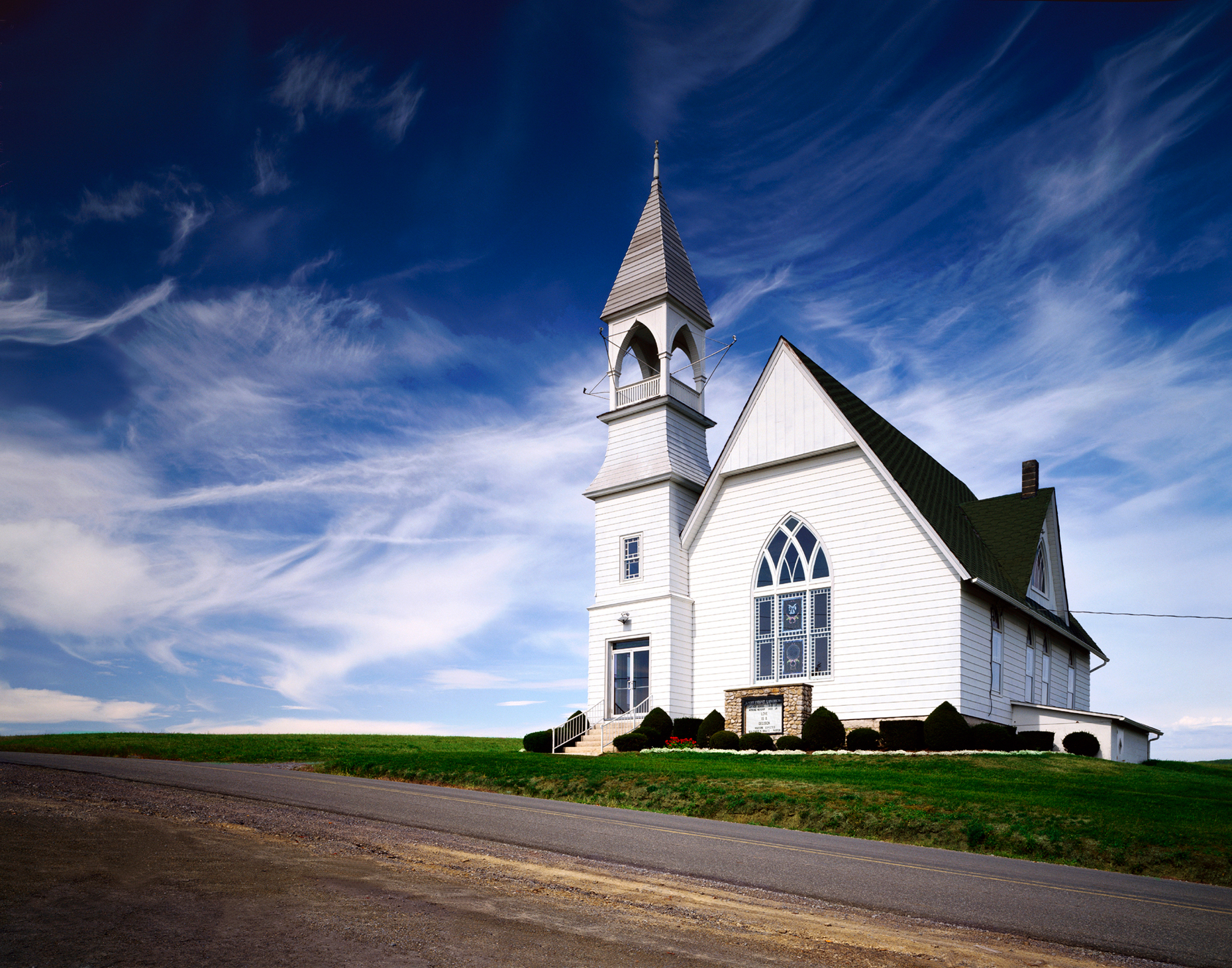 Ebenezer United Methodist Church, East Point, Pennsylania.  Simple white church stands sentinel against a crisp blue sky.