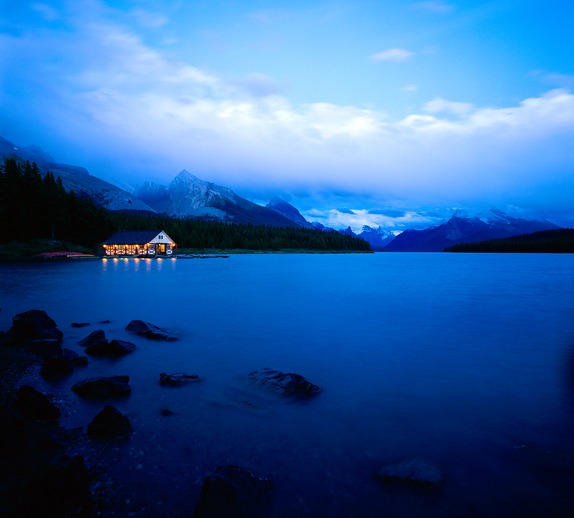 Boathouse illuminated at dusk, Maligne Lake, Jasper National Park, Alberta, Canada