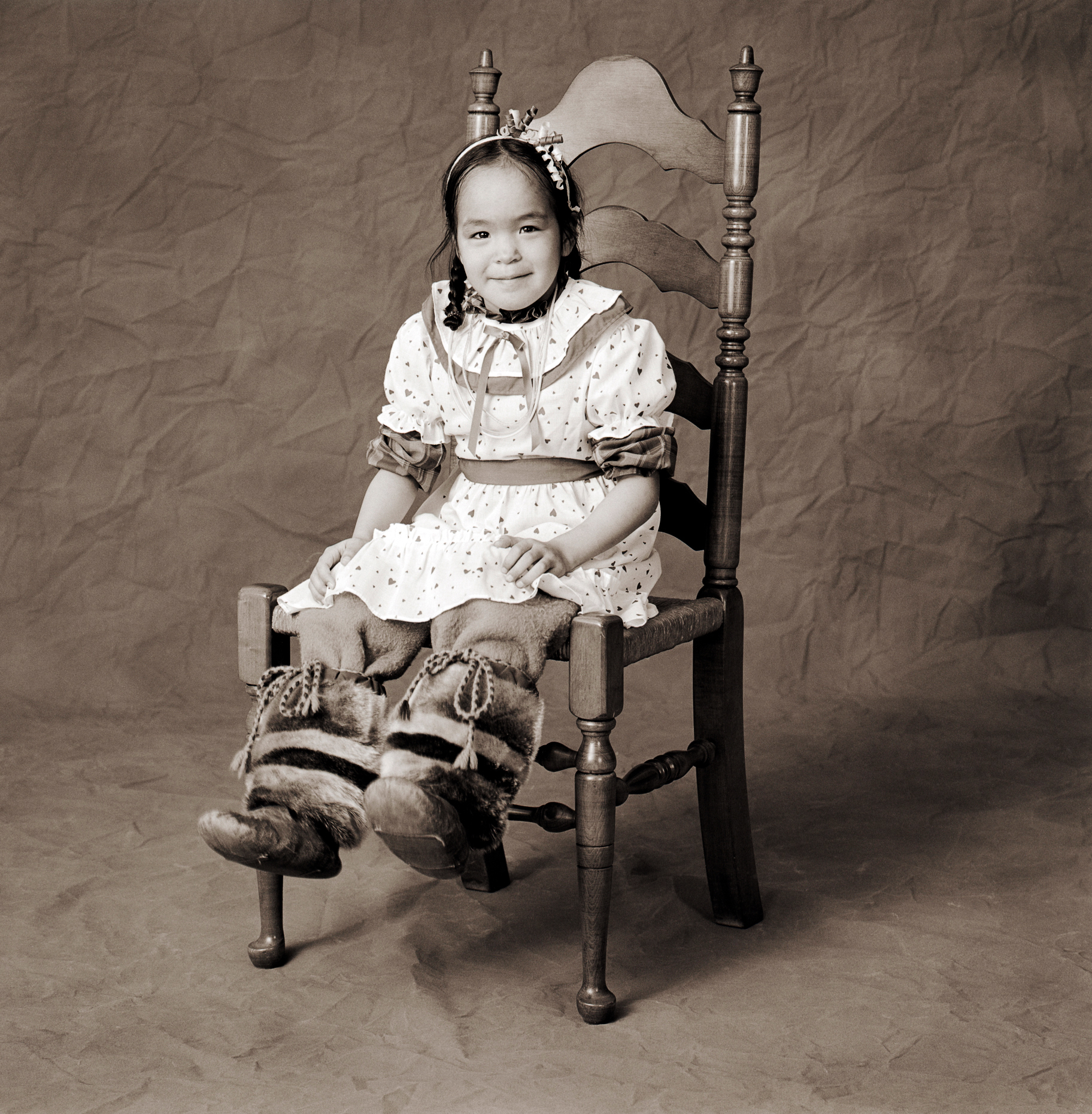 Black & white studio portrait of Inuit girl in a photography studio in Iqaluit, Nunavut, Canada