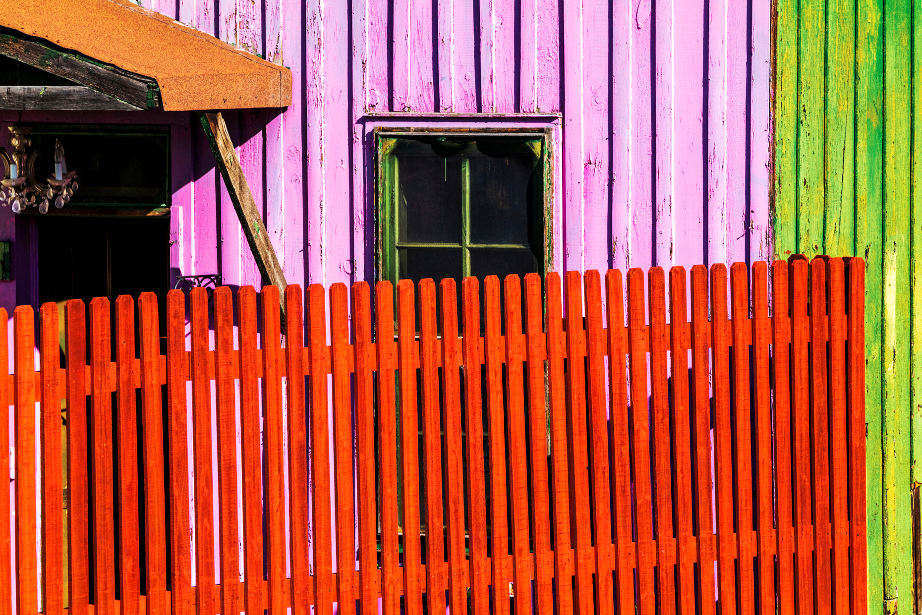Colorful fence & wooden siding; Salida; Colorado; USA