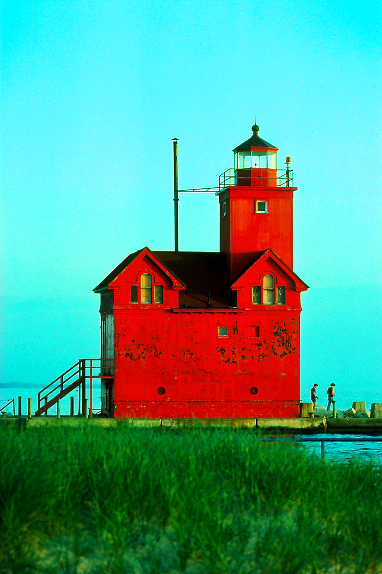 Bright red lighthouse near Holland, Michigan, on Lake Michigan.