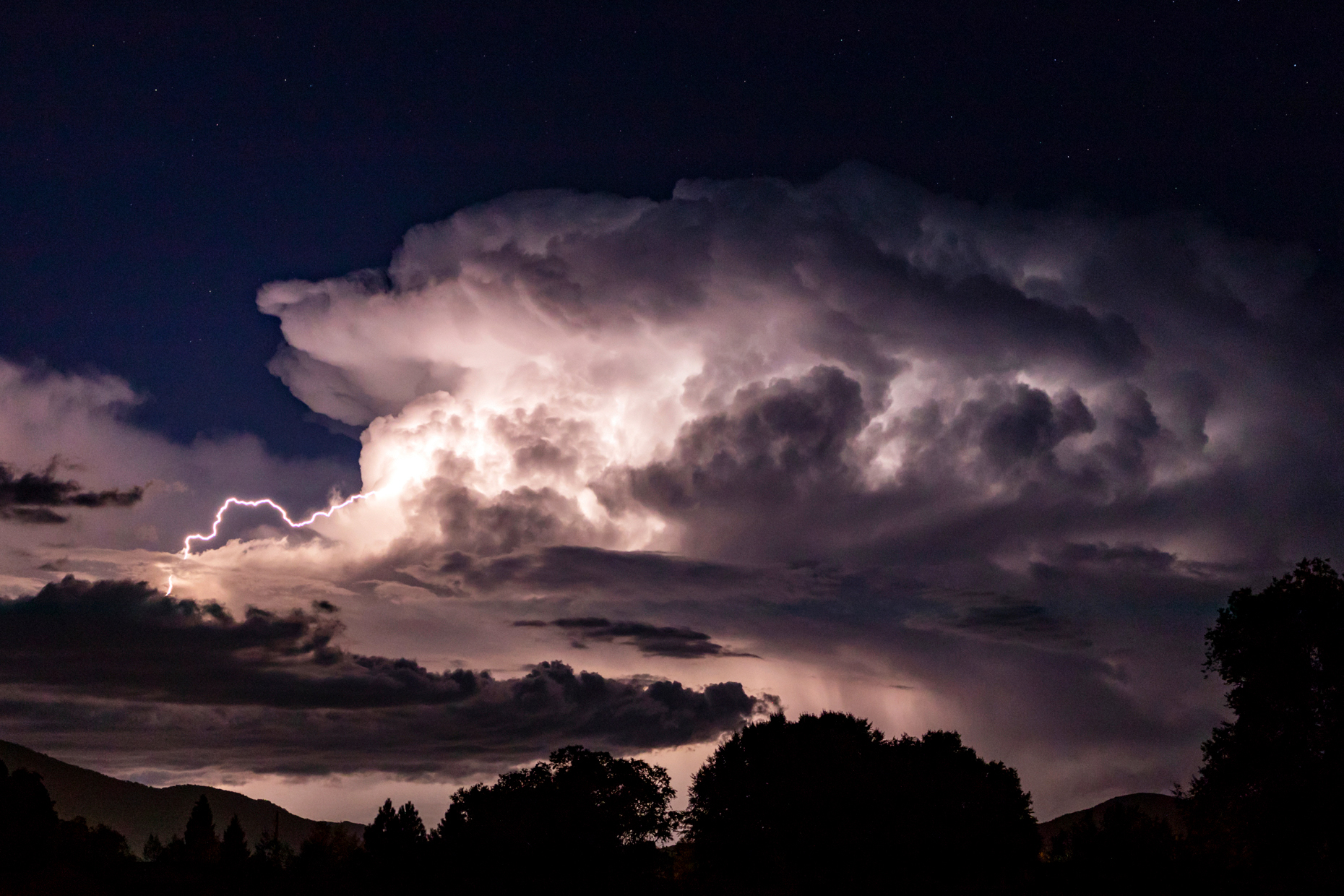 Dramatic lightning storm illuminates nighttime sky; Salida; Colo