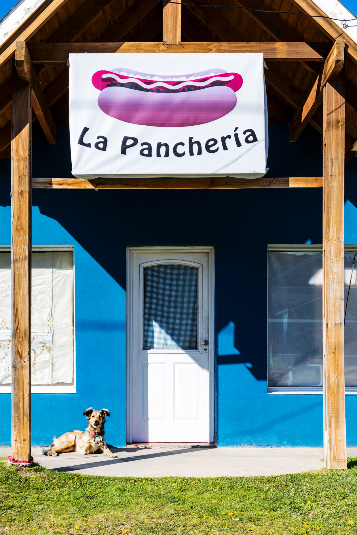 Restaurant facade & dog; small mountain village of El Chaltén; jumping off point to Cerro Torre and Cerro Fitz Roy; Patagonia; Argentina