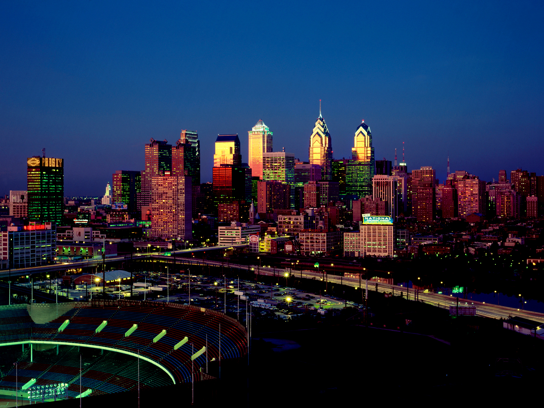 Philadelphia skyline at dusk; building reflecting the sunset sky