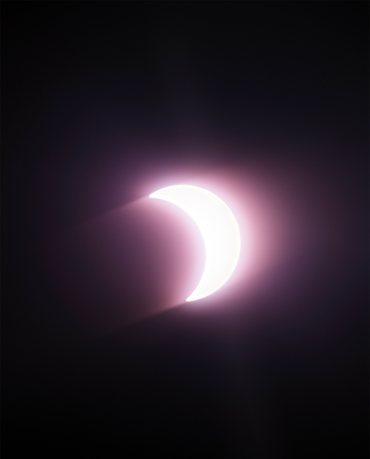 Photograph of the midday solar eclipse; the moon between earth & the sun