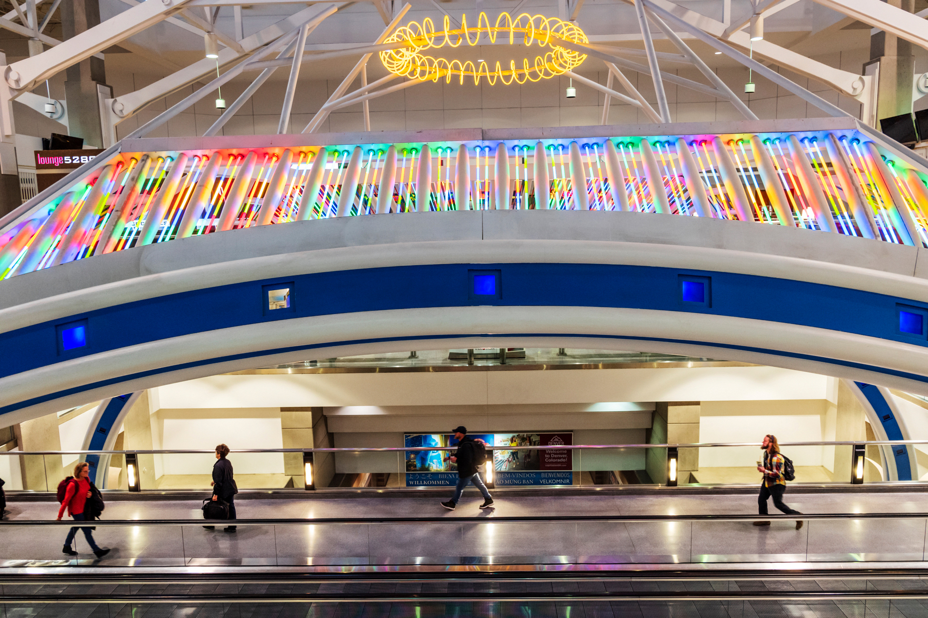 Colorful neon lights decorate a people mover at Denver Internati