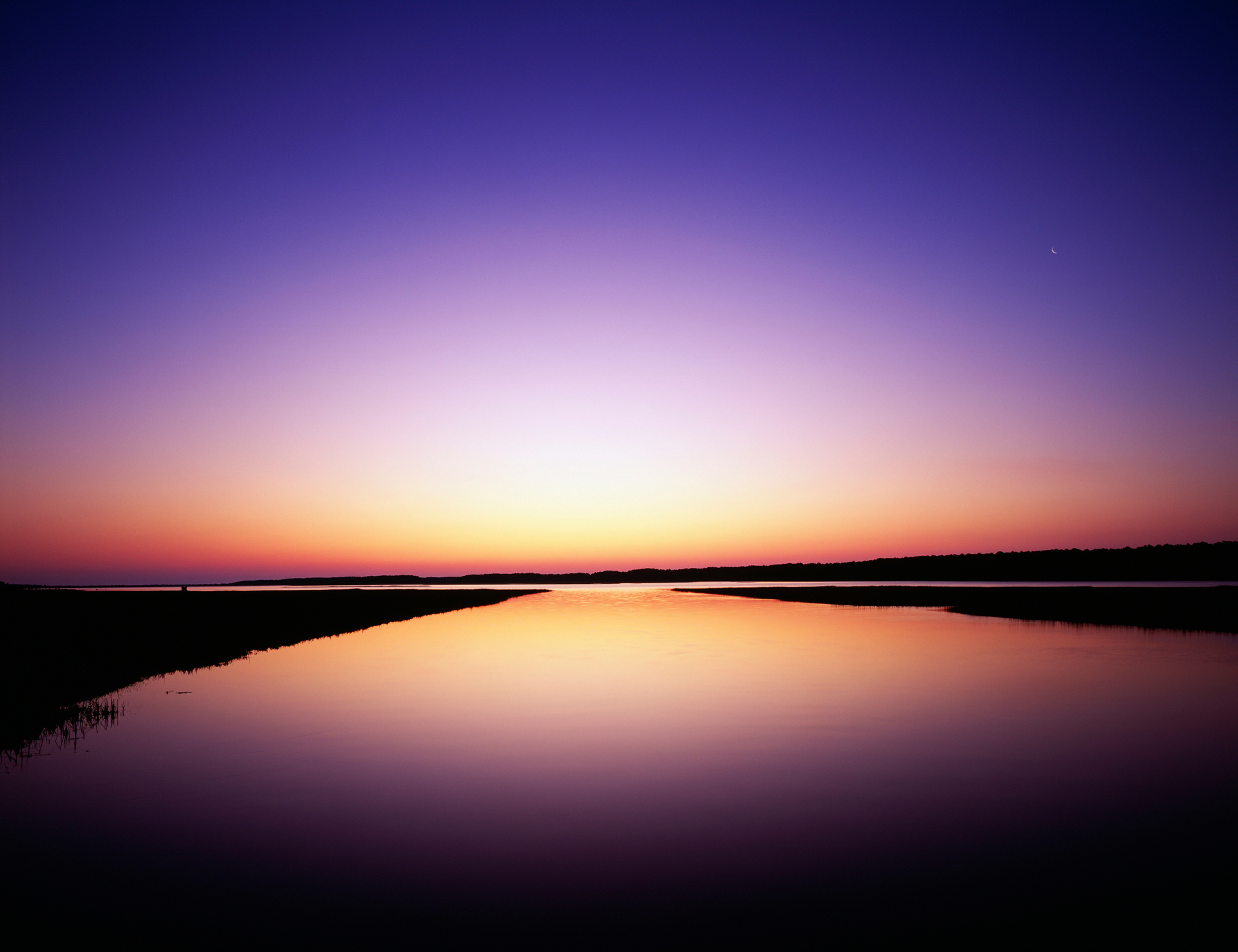 Sunrise sky reflected in the bay at Chincoteague National Wildli