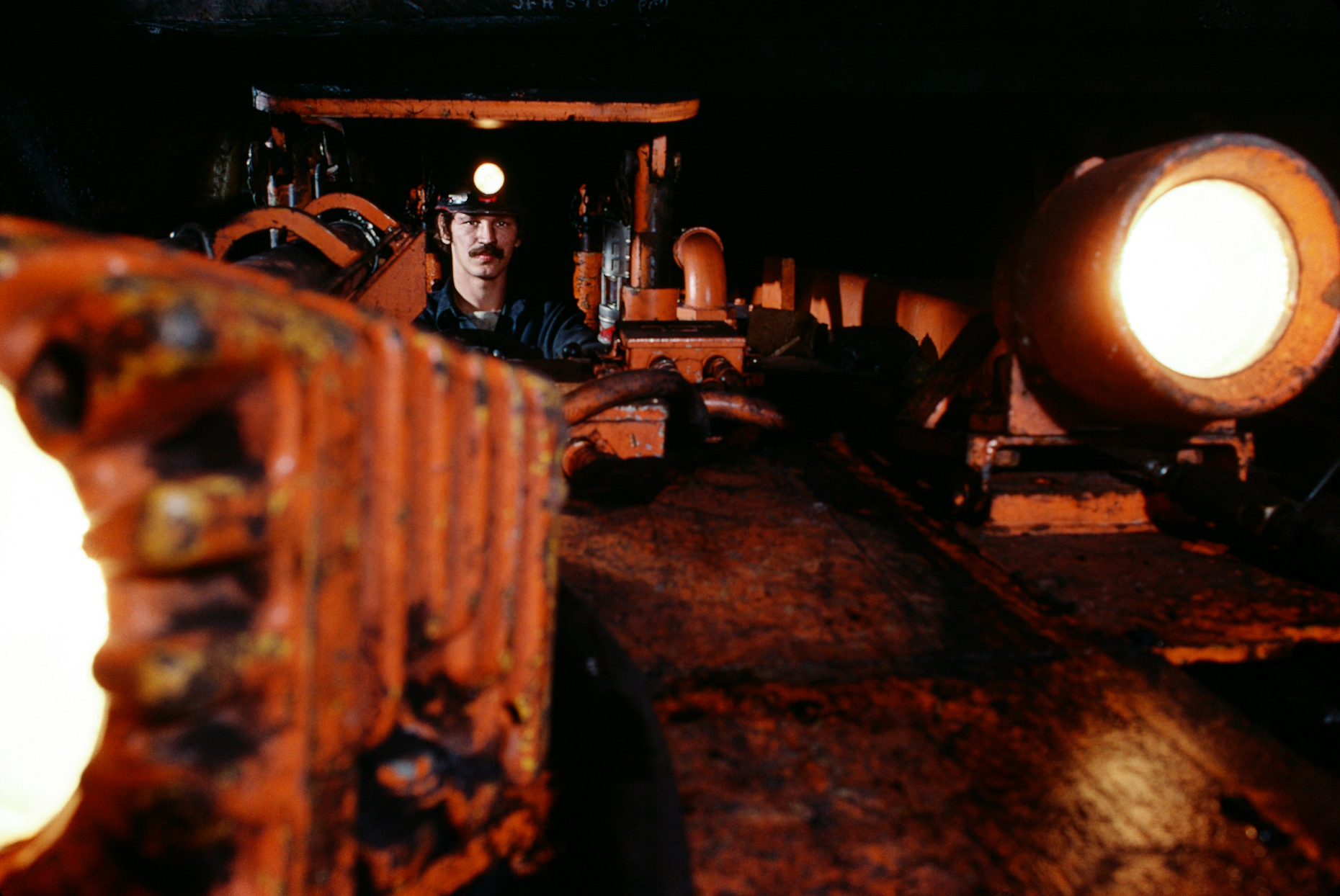 Coal miner operating heavy equipment in western Pennsylvania, US
