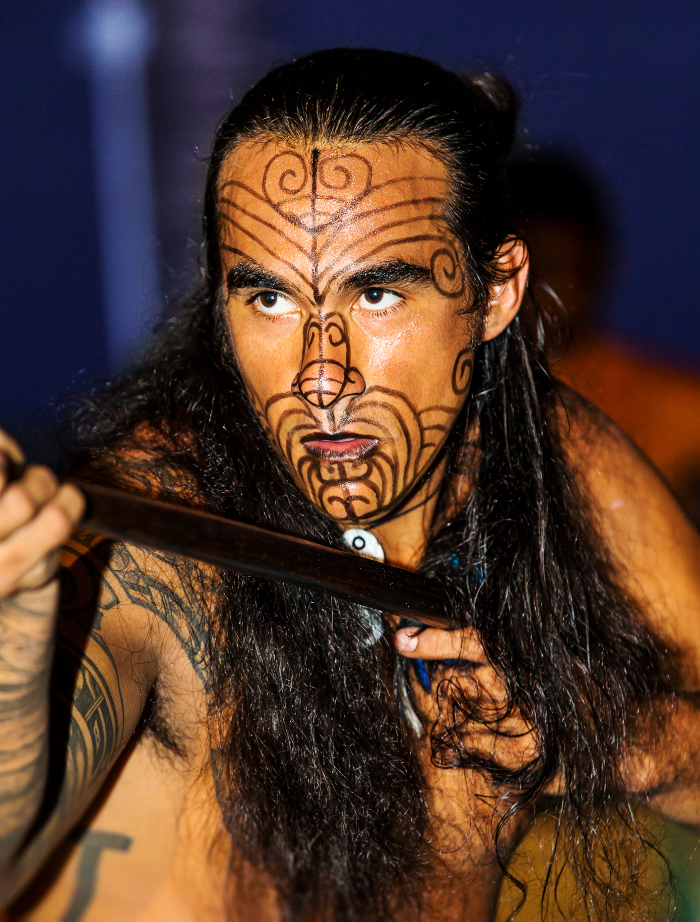 Native male Hawaiian performing traditional dance at Luau, Big Island, Hawai