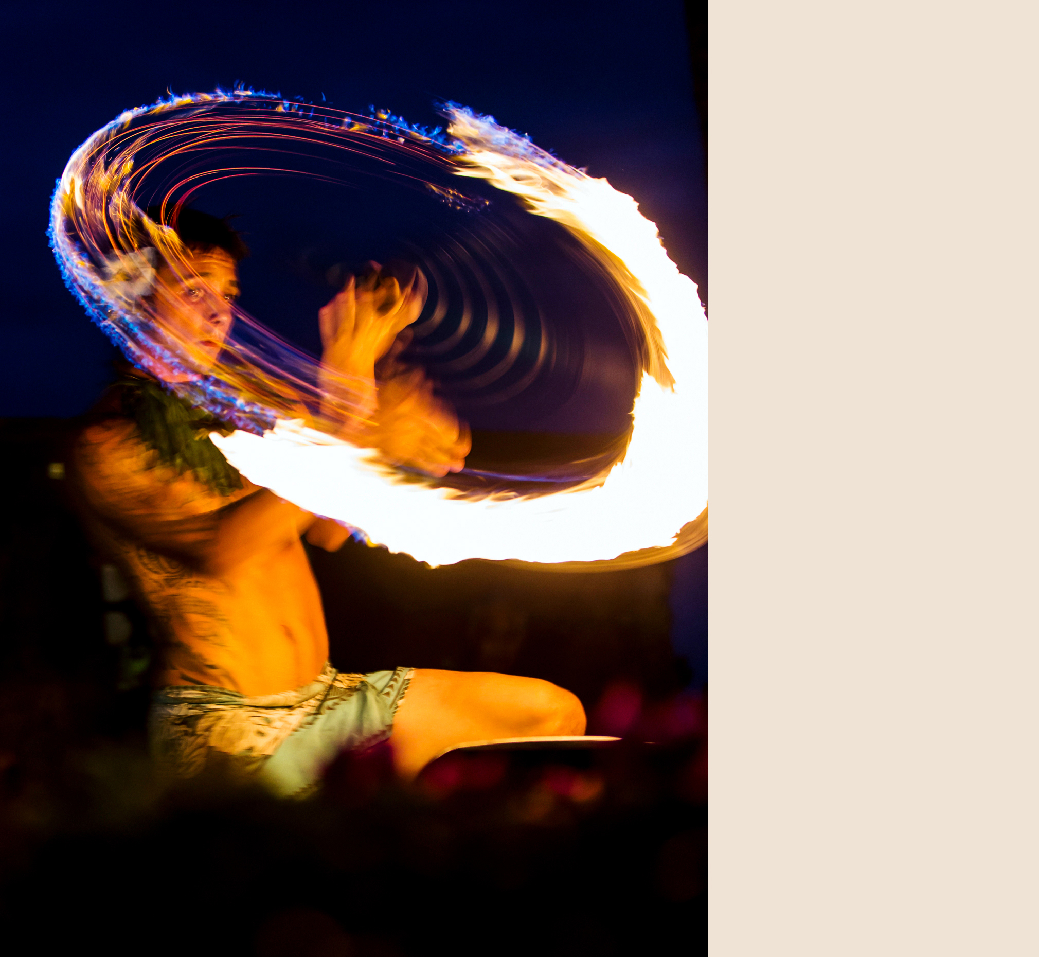 Native male Hawaiian performing traditional fire dance at Luau, Big Island, Hawai