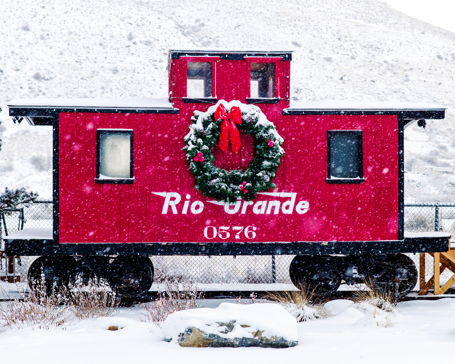 Large Christmas wreath on restored original Caboose #0576, circa 1886, built by Denver & Rio Grande Western Railway.  The D&RGWR founded Salida, Colorado, in 1880.