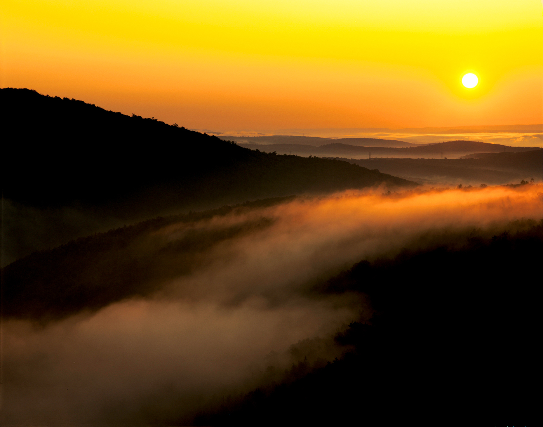 Dawn view of foggy rolling Pennsylvania countryside from Flagstaff Mountain, near Jim Thorpe & the Lehigh River, USA