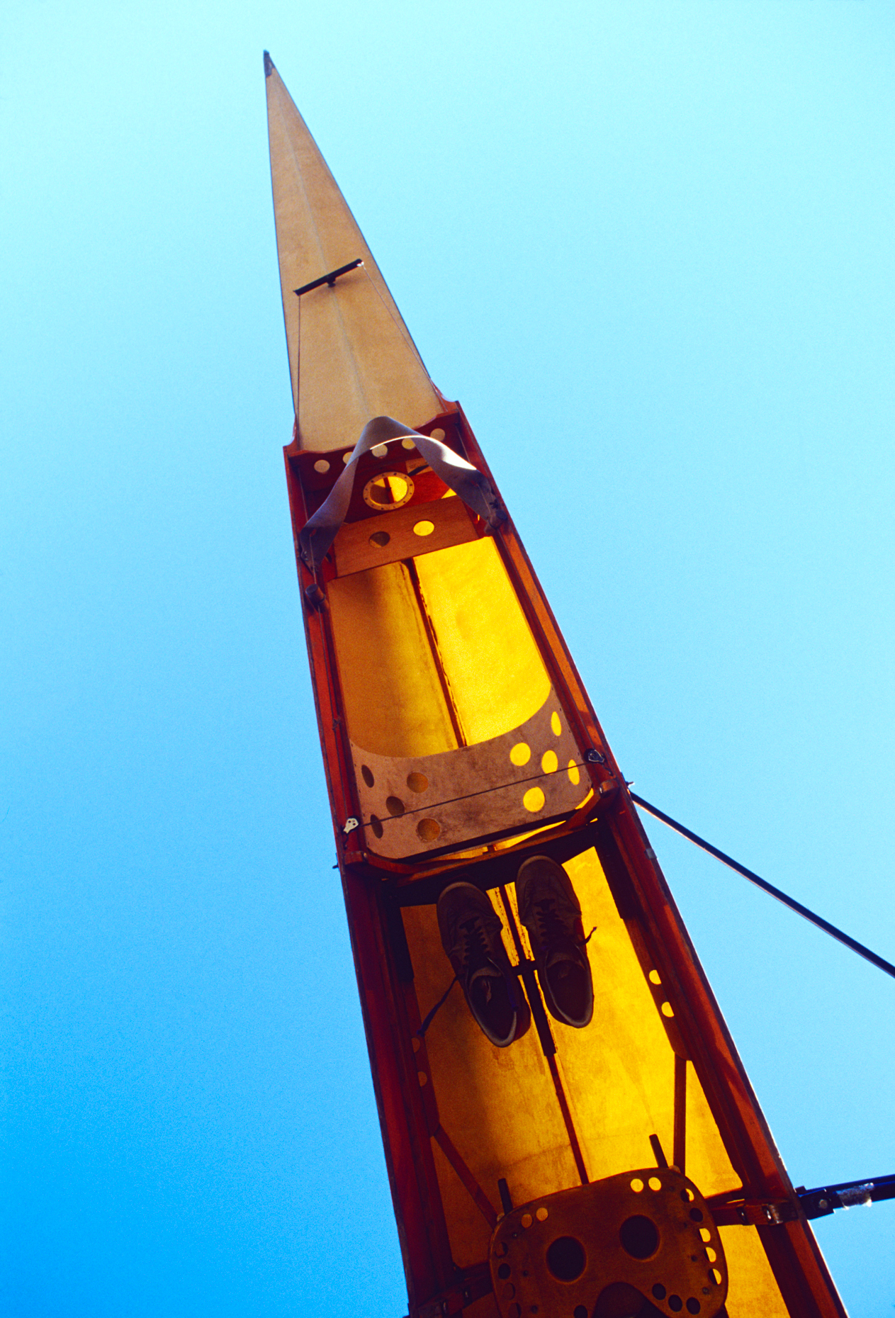 Close-up of the bow of a racing scull boat against the sky