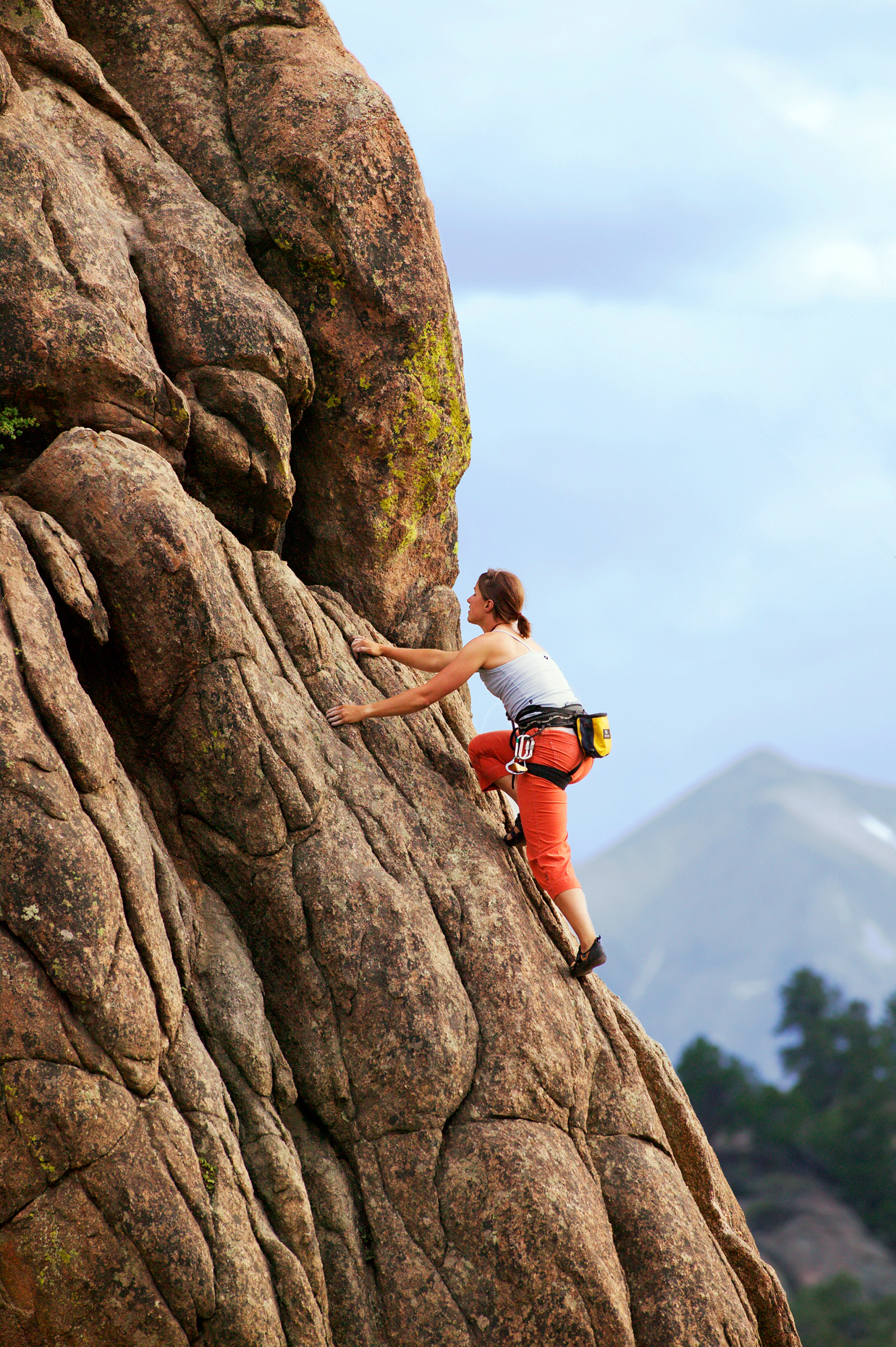 Young woman rock climbing at Elephant Rock, near Buena Vista, Colorado, USA